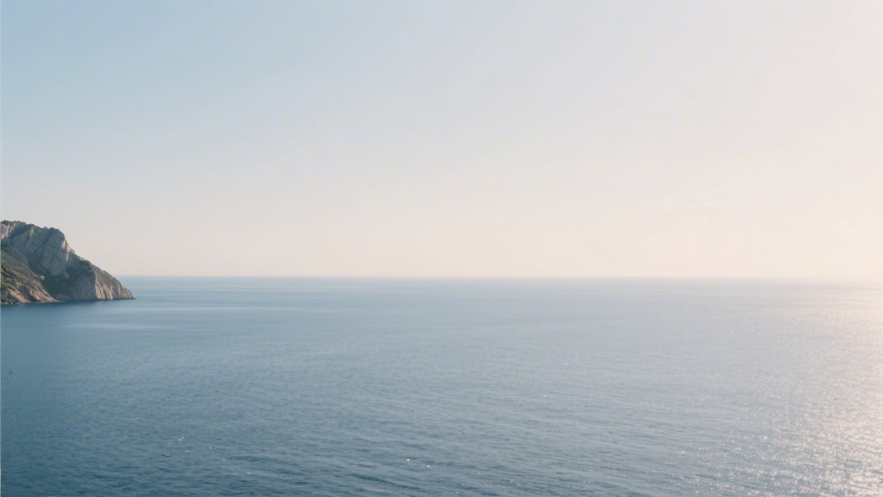Calm Mediterranean sea near Mallorca with soft light and minimal horizon, representing the serene premium tone of the academy and its web design style